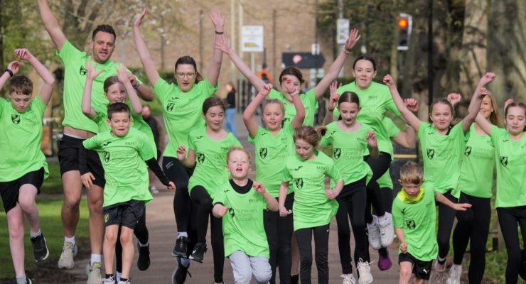 Children in green t shirts running