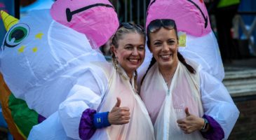 Two people in unicorn costume