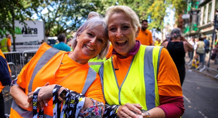 Two volunteers with medals